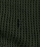 Former Merchandise Waffle LS T-shirt Surplus – surplus groene longsleeve waffle tee met subtiele Former-branding